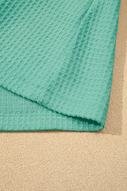 Teal waffle knit shirt with V-neck and lace trim detail