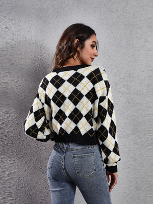 Argyle knit cropped cardigan with black, white, and yellow diamond pattern.