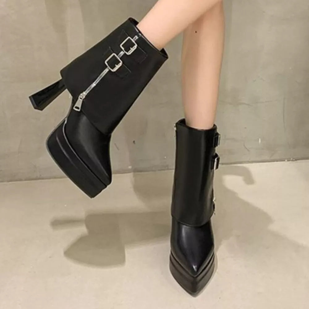 Black ankle boots with pointed toe, block heel, platform, and buckle straps.