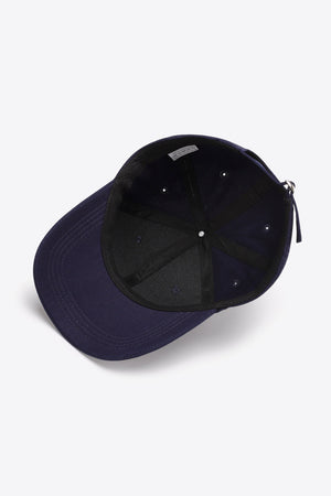 Navy cotton twill baseball cap, inside view with adjustable strap detail.