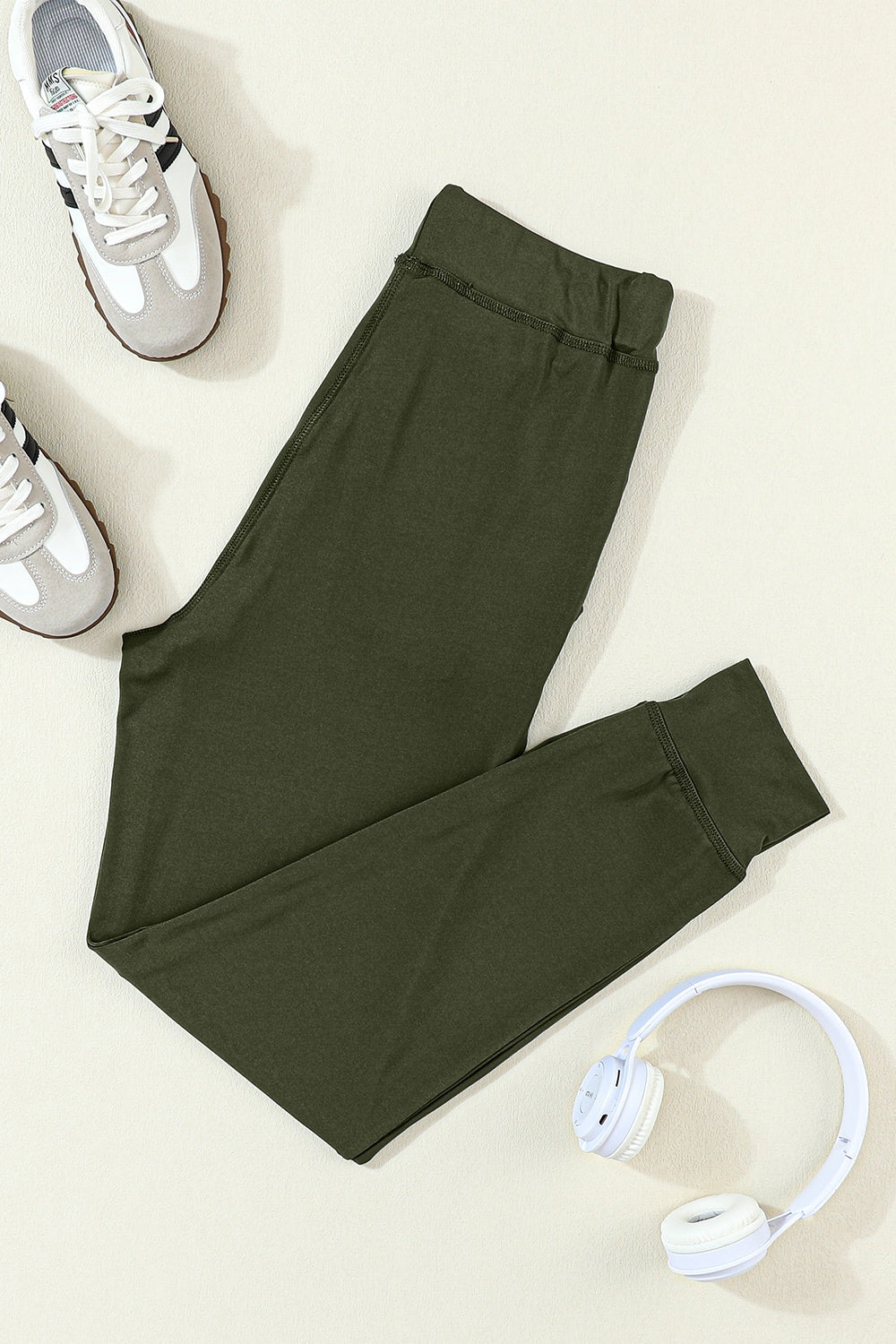 Slim-fit Army Green joggers with drawstring waist and cuffed ankles.