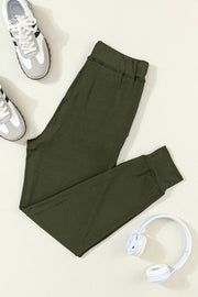 Slim-fit Army Green joggers with drawstring waist and cuffed ankles.