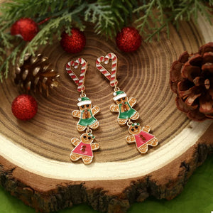 Festive gingerbread man dangle earrings with candy cane tops and green or pink outfits.