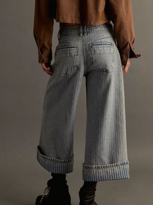 Light blue high-waisted cropped jeans with wide legs and cuffed hems.