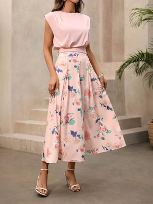 Pink structured shoulder top with floral pleated midi skirt set.