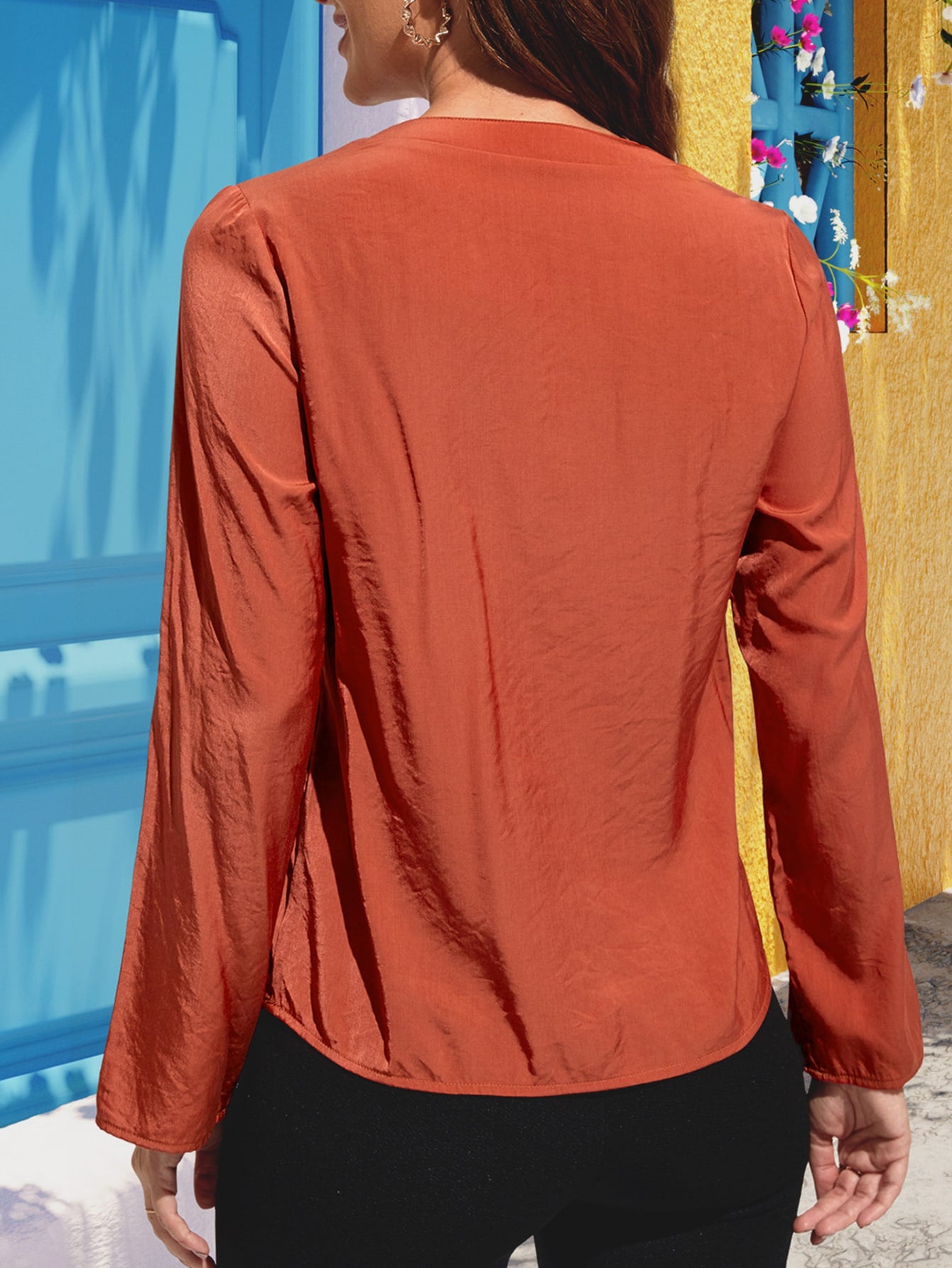 Red orange silk-effect blouse with button detail and long sleeves.