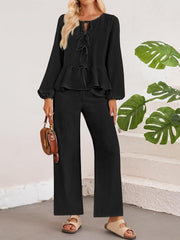 Black textured peplum co-ord set with tie-neck top and wide-leg pants
