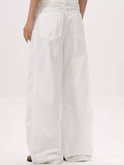 White wide-legged sweatpants with a relaxed fit and back pockets.