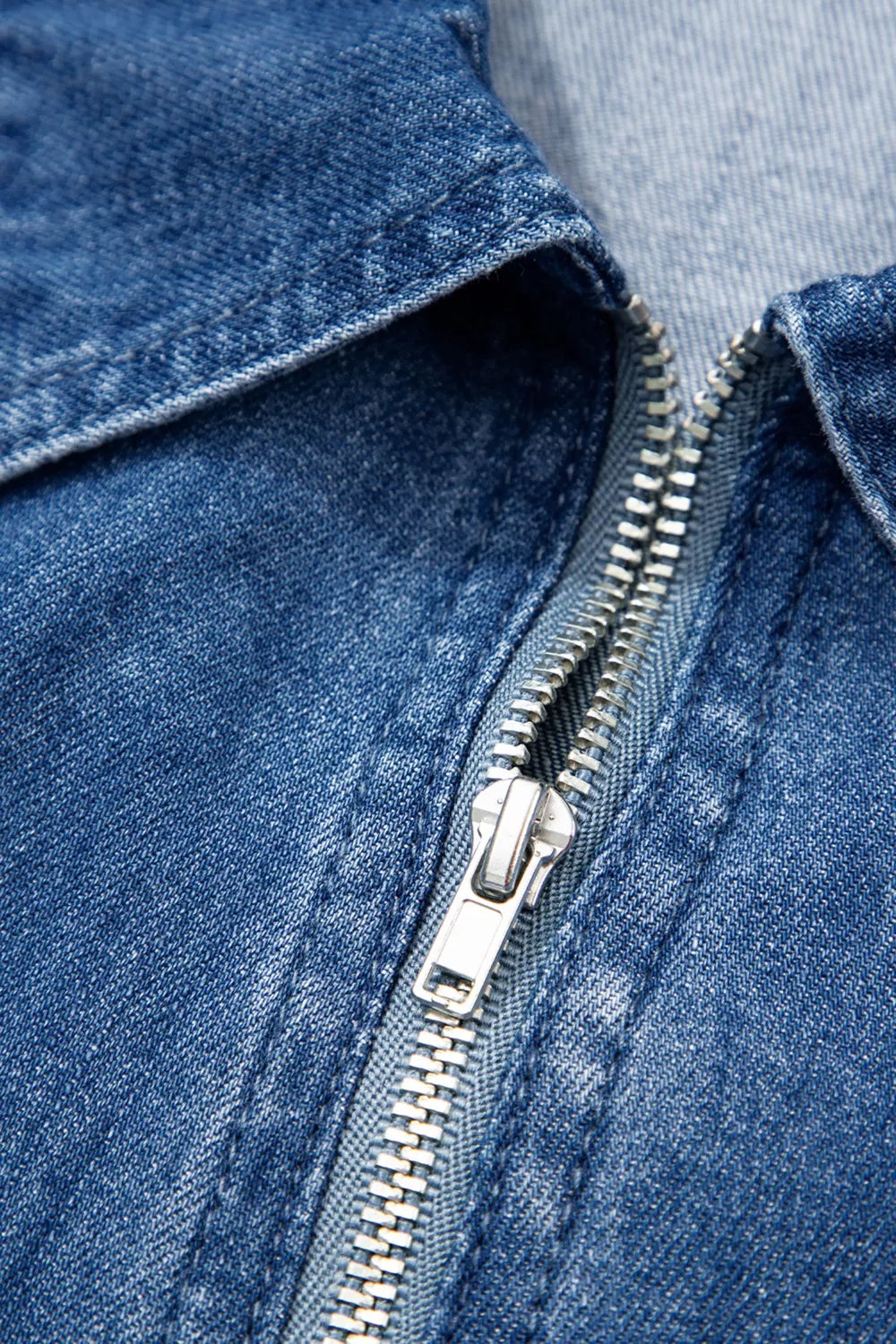 Denim shift dress with collared neckline and silver zipper detail.