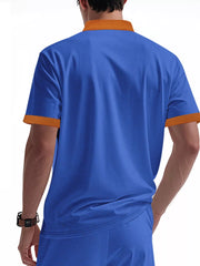 Men's sapphire blue short sleeve tee with orange collar and cuffs, textured fabric.