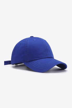 Cobalt canvas baseball cap with adjustable strap and stitched details.