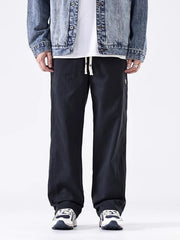 Men's black loose fit drawstring sweatpants with a relaxed cut.