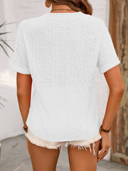 White eyelet henley relaxed fit top with short sleeves and a textured pattern.