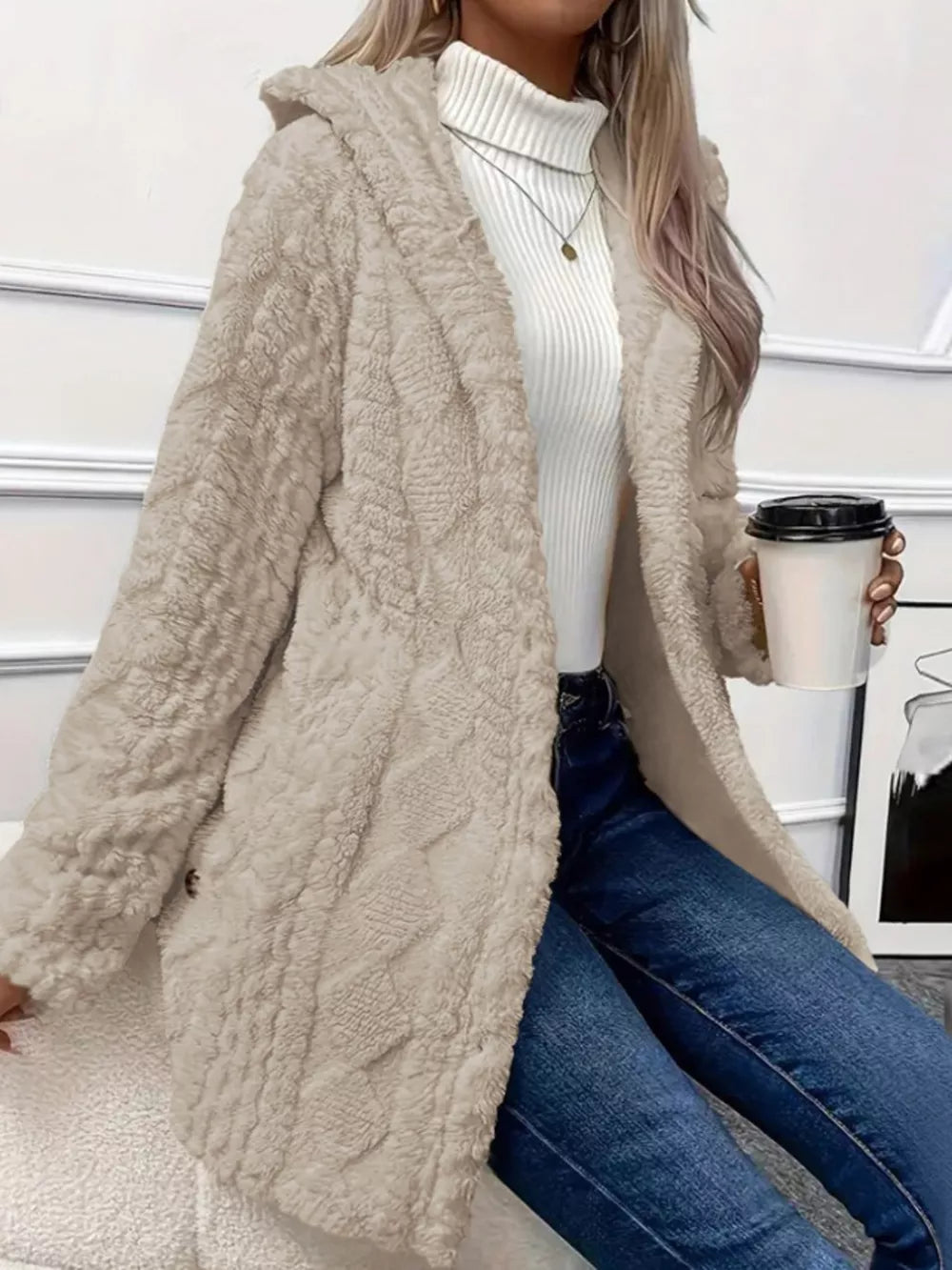 Apricot teddy bear hooded trench coat with button detail and textured pattern.