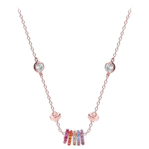 Rose gold necklace with a fine chain, clear bezel-set crystals, and a colorful crystal-encrusted ring charm.