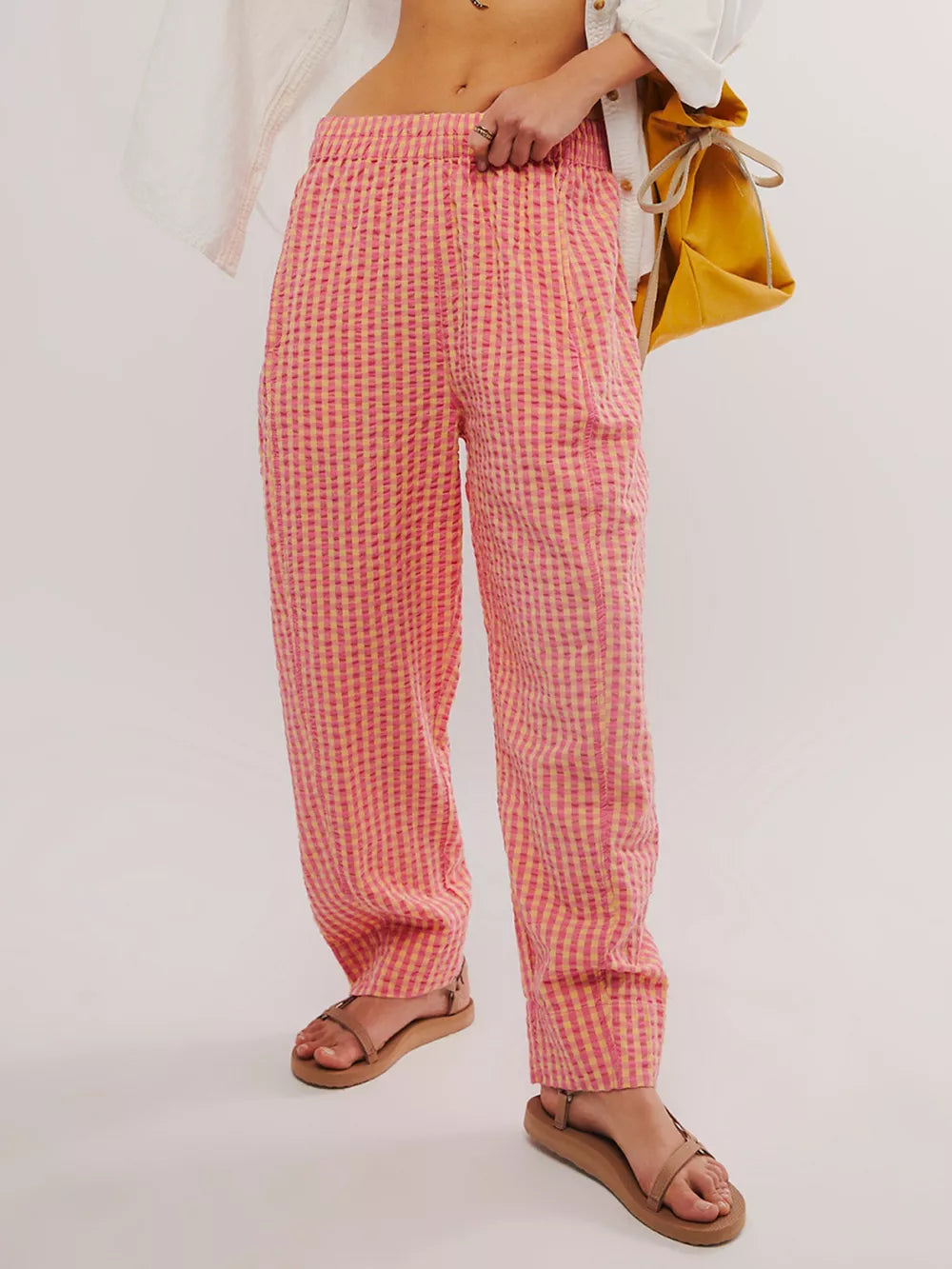 Gingham check wide-leg pants in pink and yellow with pockets.
