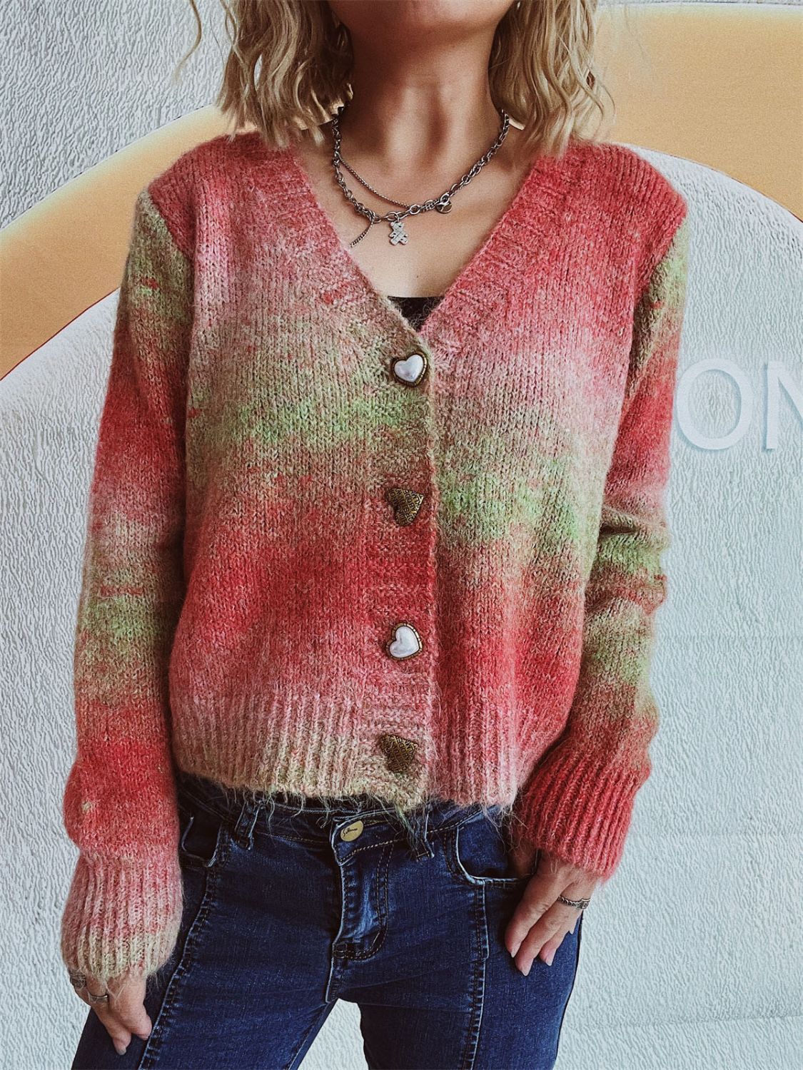 Ombre knit cardigan with heart buttons and v-neck.