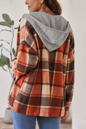 Plaid hooded shacket in orange, tan, and brown with a relaxed fit.