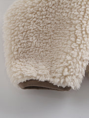 Beige sherpa zip-up jacket with brown trim detail.