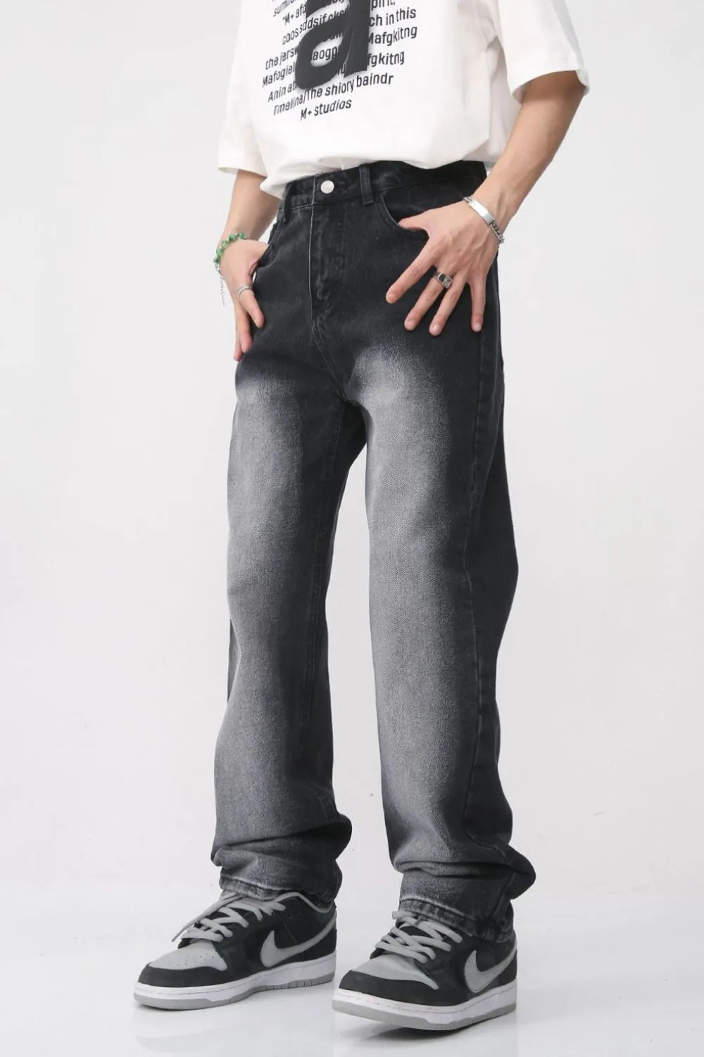 Faded wash baggy jeans in dark, relaxed fit denim with a gradient effect.