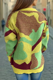 Geometric knit crewneck sweater in canary yellow with abstract colorblock pattern and maroon accents.