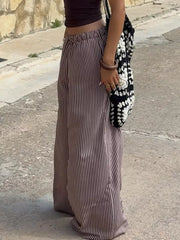 Tied striped wide-leg pants in brown and white, featuring a comfortable elastic waist.