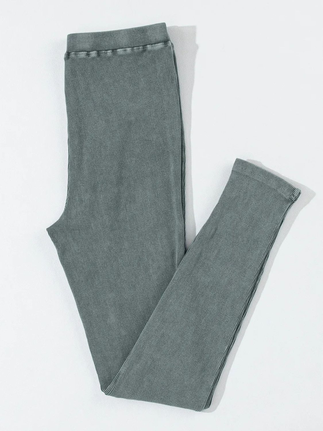 Dark gray ribbed leggings with a comfortable elastic waistband.