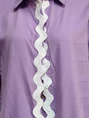 Lilac linen pajama top with white scalloped trim detail down the front.