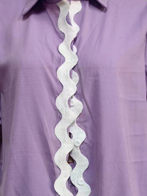 Lilac linen pajama top with white scalloped trim detail down the front.