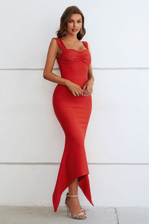 Red ruched bustier gown with asymmetric hemline and spaghetti straps.