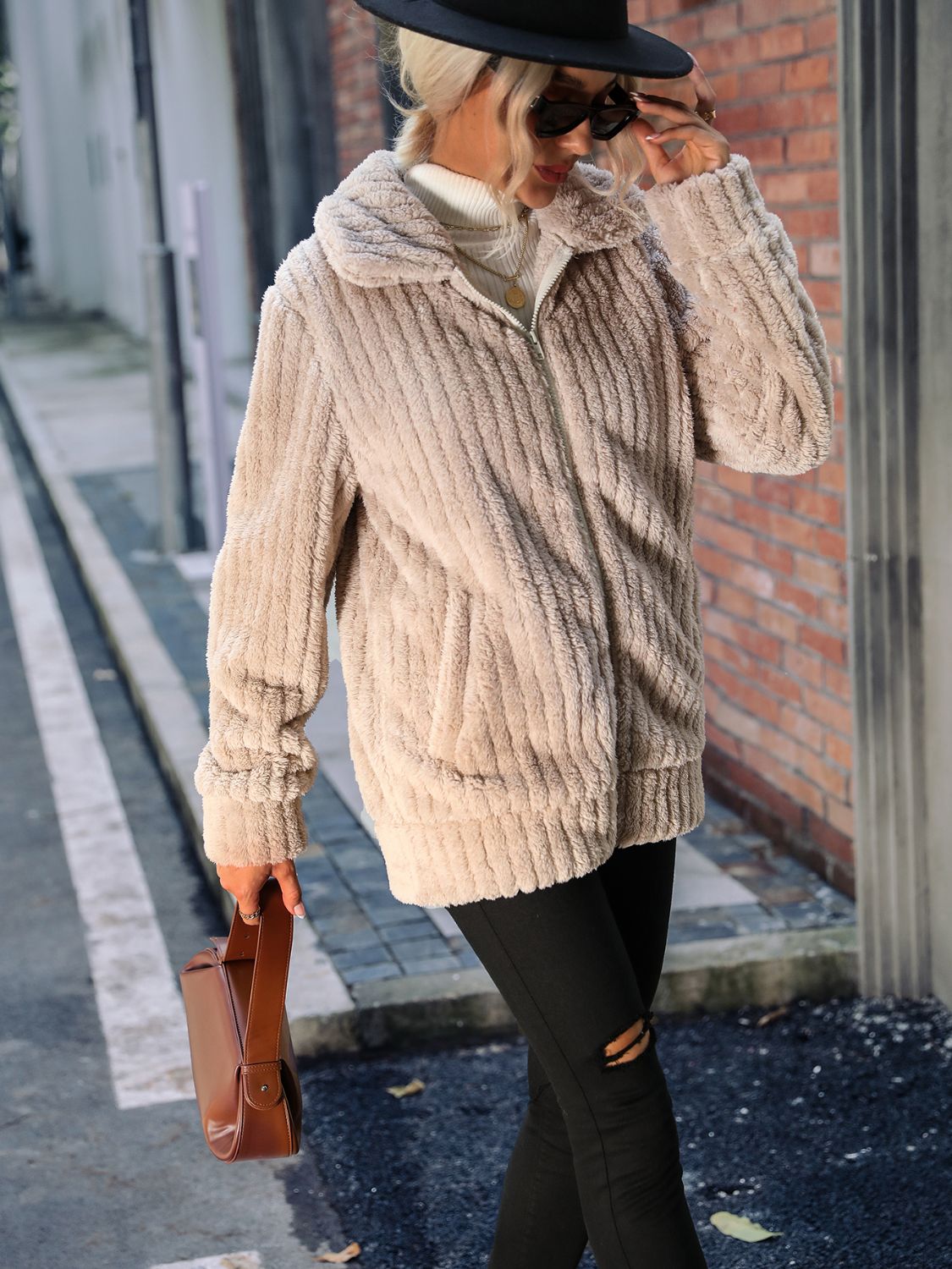 Plush ribbed zip-up jacket in Sand with a collared neckline and pockets.