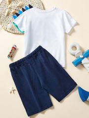 Toddler dinosaur graphic t-shirt and navy shorts set with blue spikes on collar.