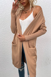 Khaki ribbed cuff open-front cardigan with pockets, styled with a white cami and ripped jeans.