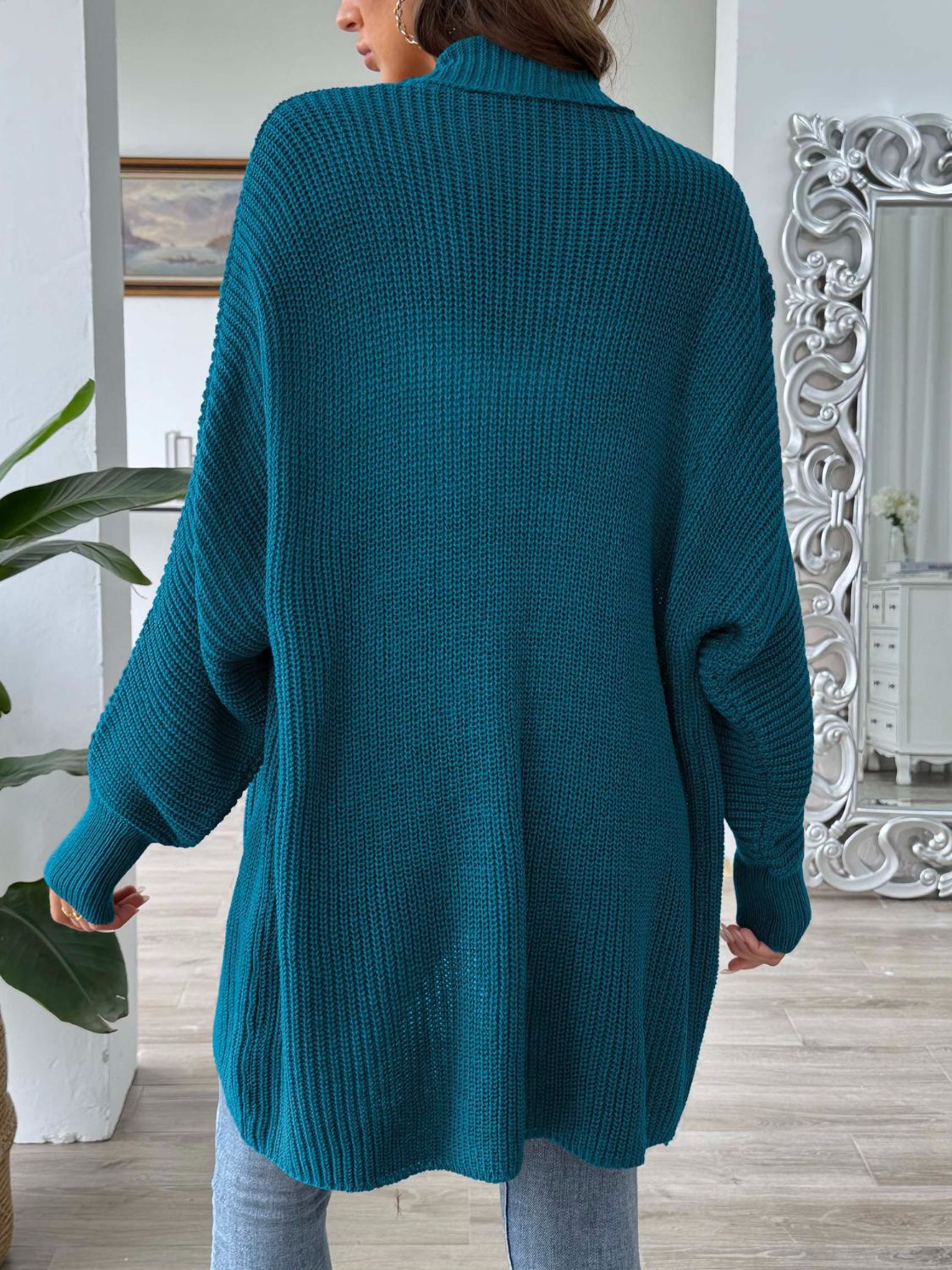 French Blue ribbed knit cardigan with pearl buttons, long sleeves, and a relaxed fit.
