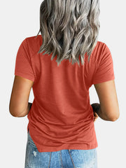 Raglan pocket t-shirt in watermelon pink with short sleeves and a curved hem.