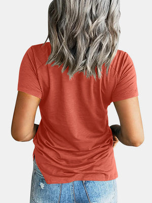 Raglan pocket t-shirt in watermelon pink with short sleeves and a curved hem.