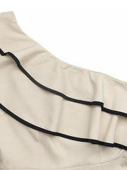 Cream one-shoulder romper with black trim and ruffle detail