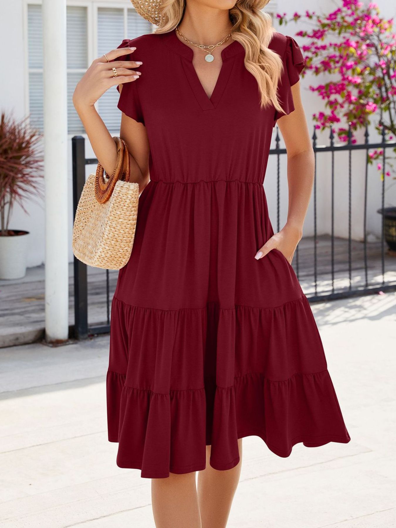 Burgundy ruffled midi dress with notched V-neck and tiered skirt