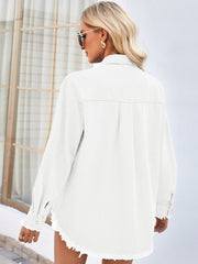 White denim shirt with frayed hem and cuffs, long sleeves, button front, and back yoke detail.