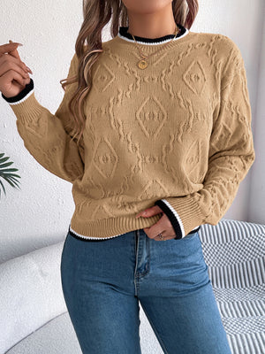Tan acrylic knit sweater with diamond texture and contrast trim neckline and cuffs.