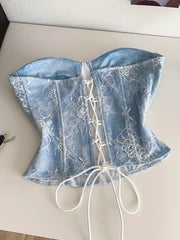 Blue lace corset top with white lace overlay and adjustable front lacing