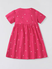 Toddler aline dress in pink cotton with a scattered floral print and short sleeves.