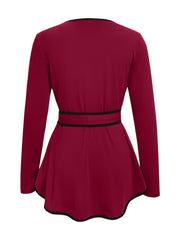 Burgundy peplum blouse with long sleeves, tie detail at waist, and black trim.