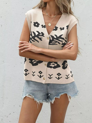 Tan floral-patterned V-neck button-down knit cardigan vest with short sleeves.