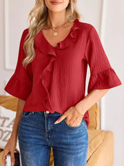 Red maternity shirt with V-neck and cascading ruffles, 3/4 bell sleeves.