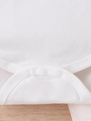 White baby bodysuit with snap closure detail and subtle bunny graphic on lower portion.