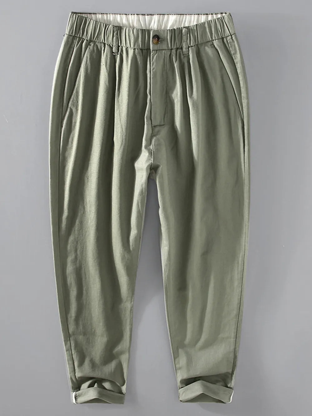 Men's relaxed fit cropped sweatpants in sage with elastic waistband and cuffed hems.