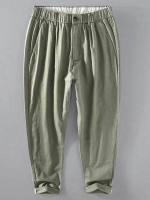 Men's relaxed fit cropped sweatpants in sage with elastic waistband and cuffed hems.