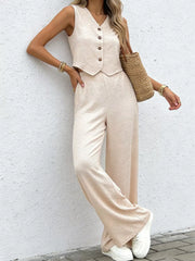 Chic beige button-down vest and flowing wide-leg pants set with textured fabric.