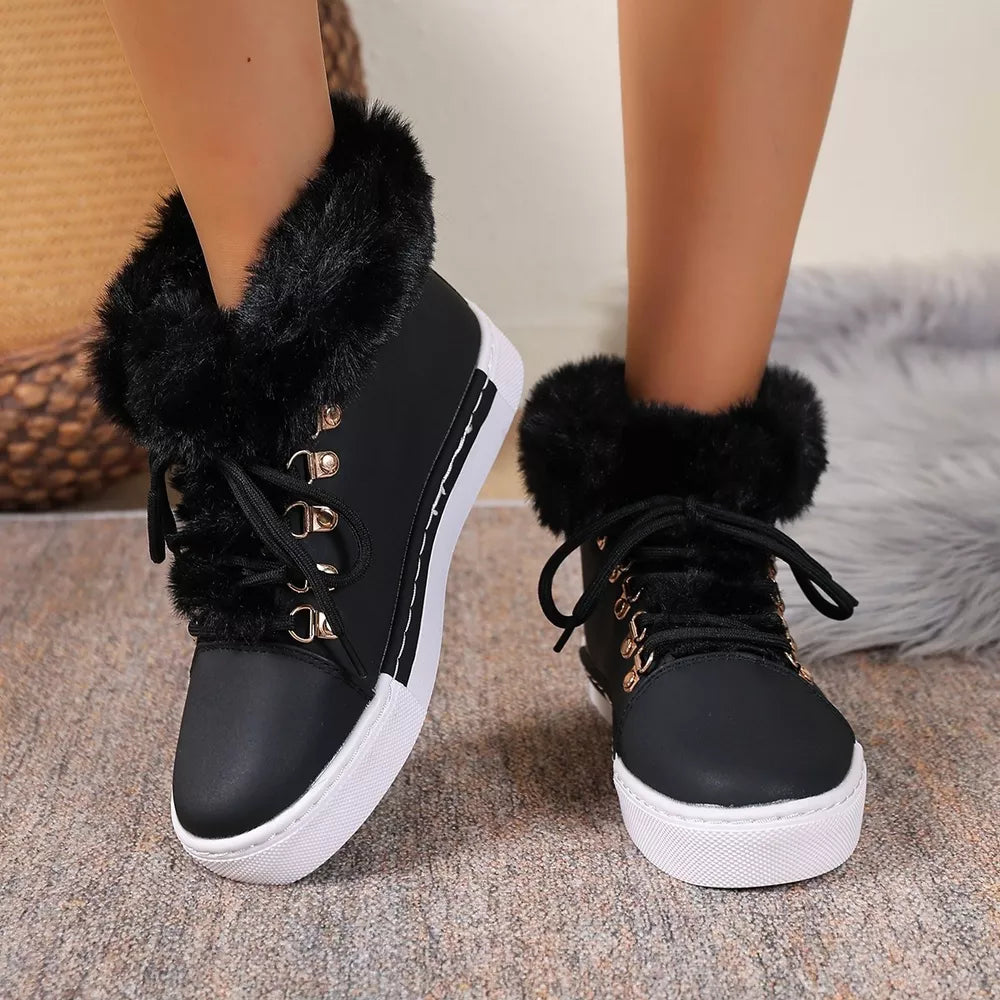 Black fluffy cuff round-toe platform boots with white soles and gold eyelets.